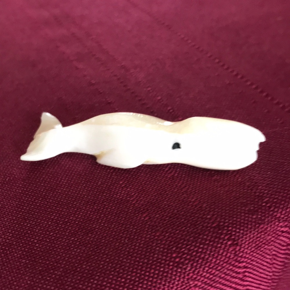 Hand carved white whale by Eskimo